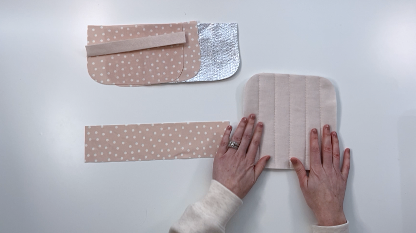 Layers secured using quilting stitches