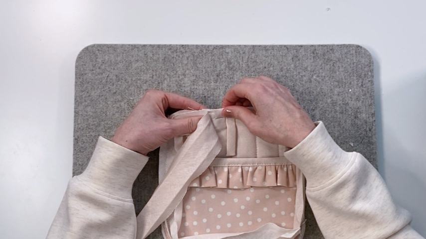 Folding bias tape starting end into place