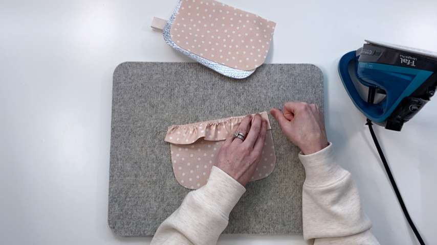 Gathering the fabric for the ruffle detail